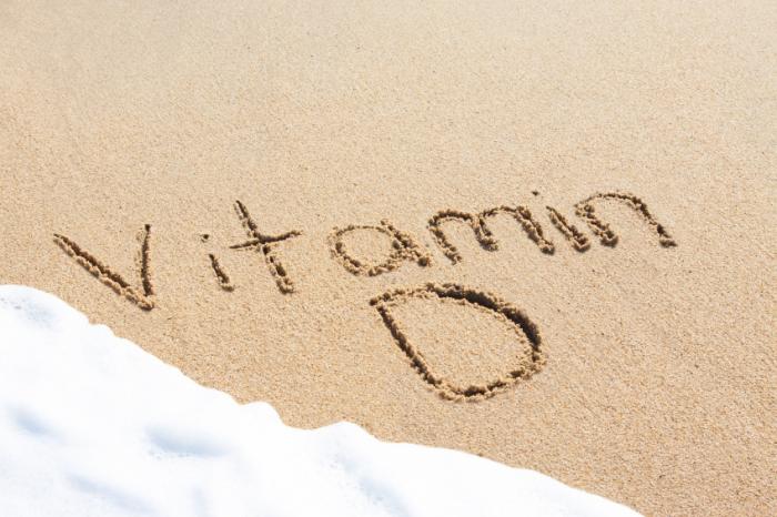 [vitamina D scritta sulla sabbia]